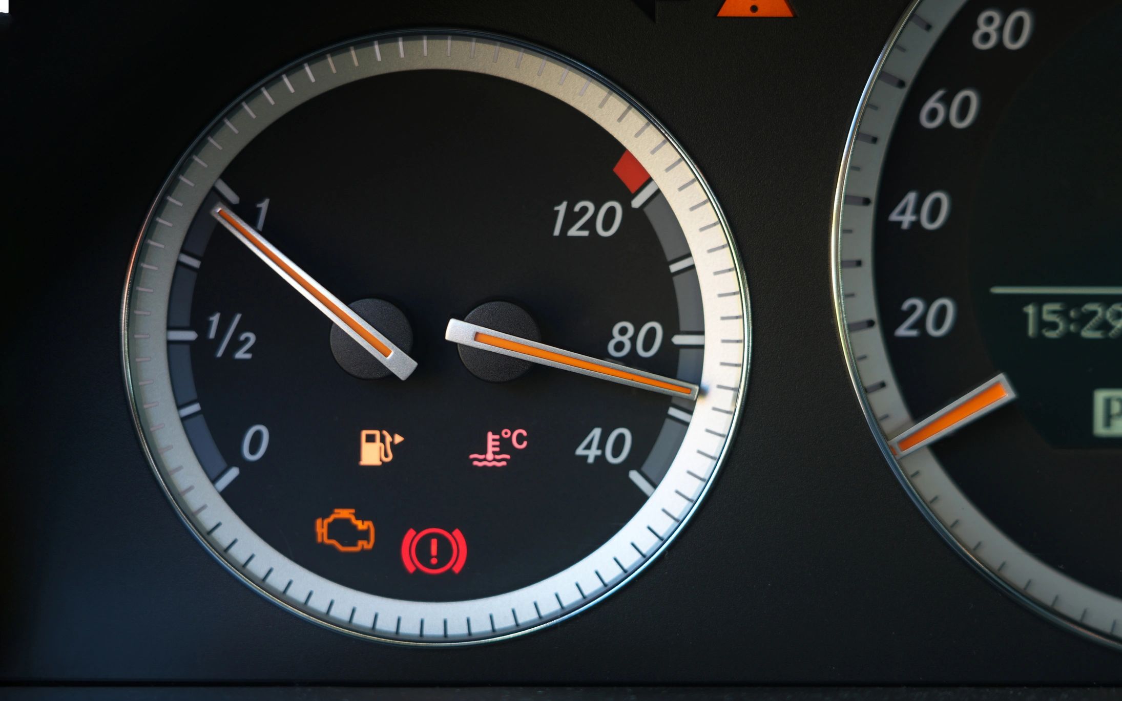 Car dashboard warning lights close-up