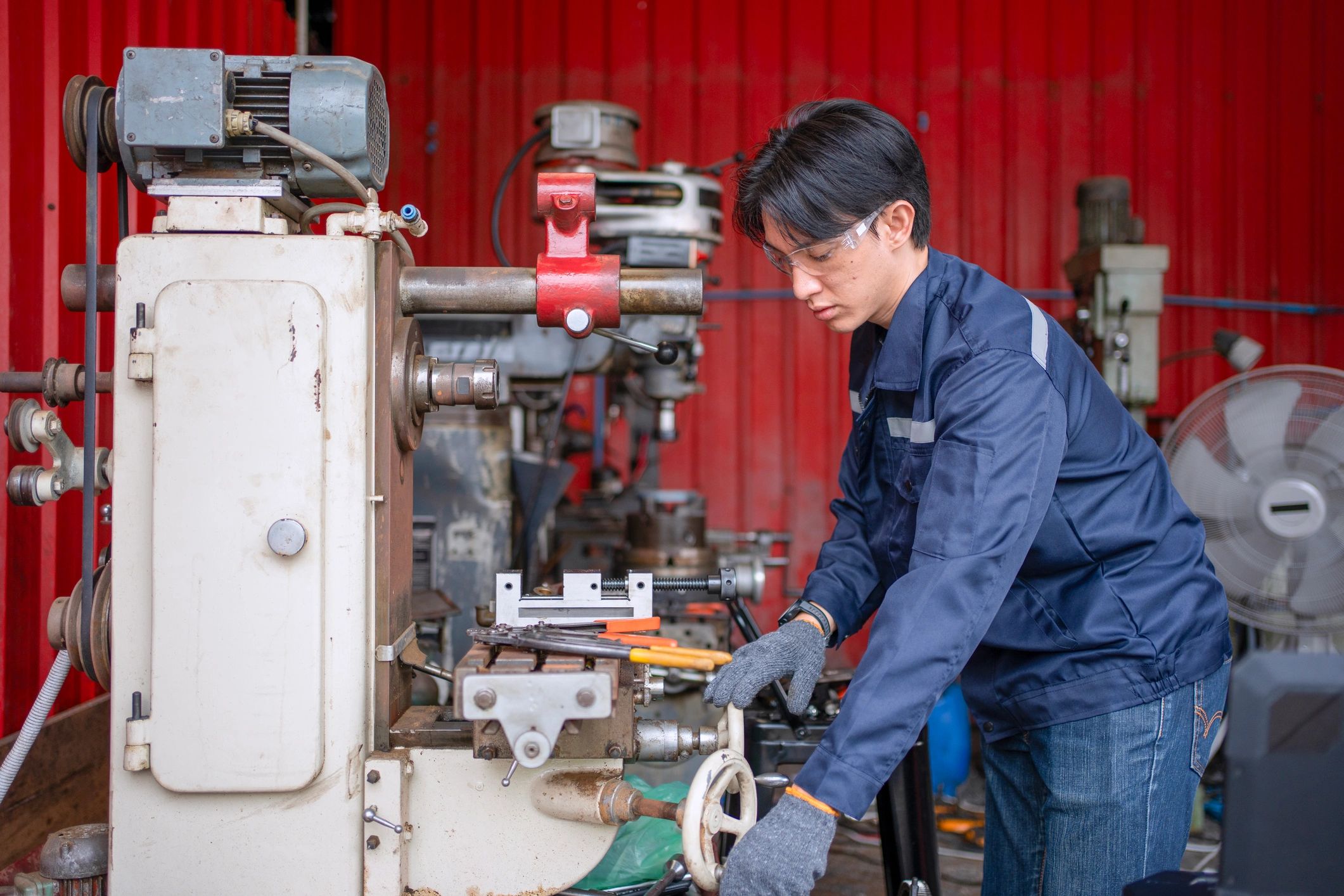 Technician working in an automotive service bay